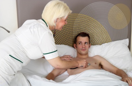 Mature nurse with blonde hair seduces a man while he's ill in bed
