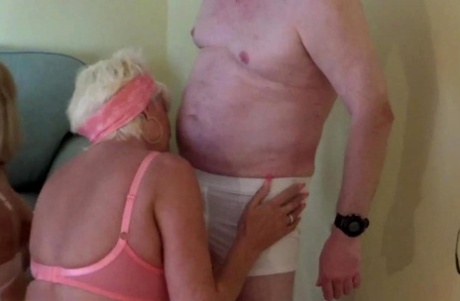 Blonde granny Dimonty shares a mouthful of cum with a bisexual woman