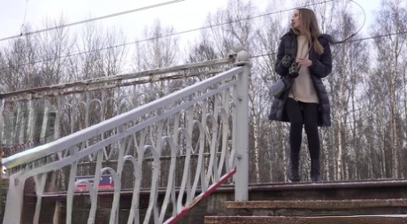 Caucasian female Valya takes a piss on snow-covered steps in public