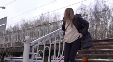 Caucasian female Valya takes a piss on snow-covered steps in public