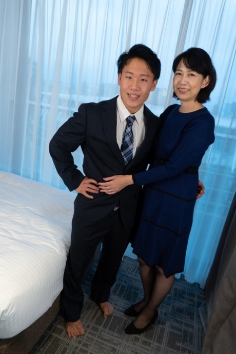 Mature Japanese woman has sex with her man friend while wearing OTK hosiery