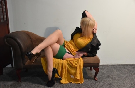 Mature amateur Barby Slut takes off a long dress to model in her underthings