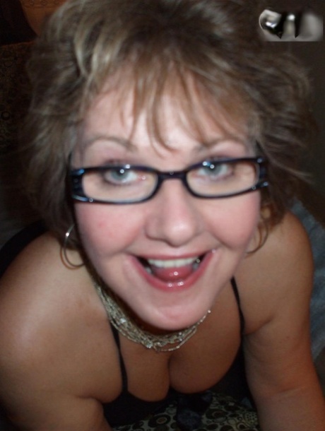 Older lady Busty Bliss shows her natural tits while playing with a sex toy