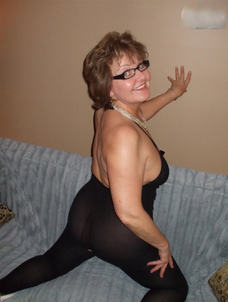 Older lady Busty Bliss shows her natural tits while playing with a sex toy