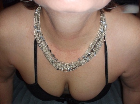 Older lady Busty Bliss shows her natural tits while playing with a sex toy