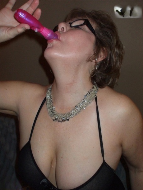 Older lady Busty Bliss shows her natural tits while playing with a sex toy