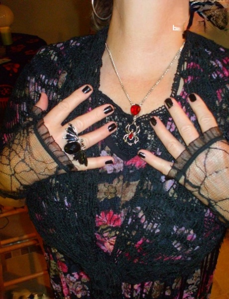 Older lady Busty Bliss releases her natural tits over a Ouija board