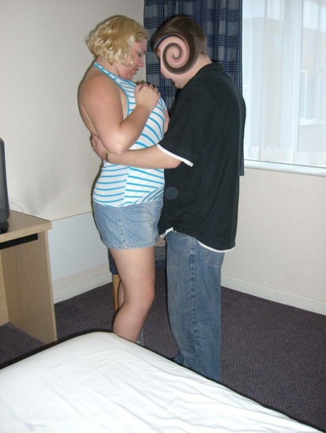 Older blonde Barby sucks off a cock after getting naked in a hotel room