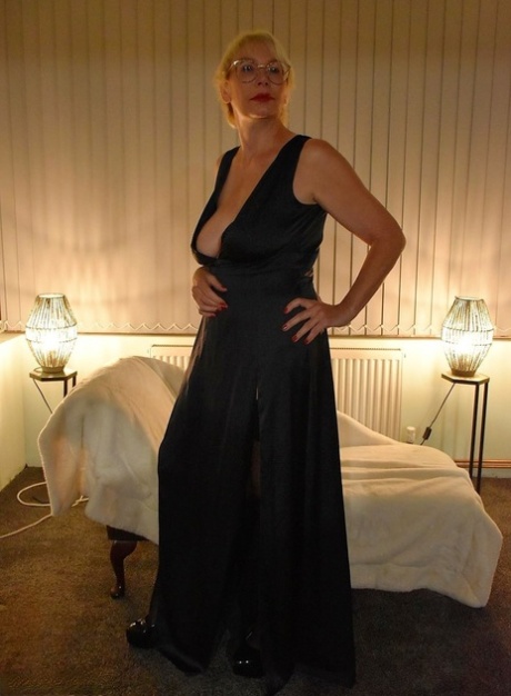 Mature British lady with blonde hair Barby Slut goes nude in black nylons