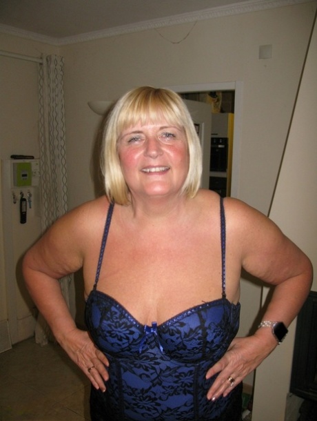 Older blonde BBW Chrissy Uk looses her boobs from lingerie during solo action