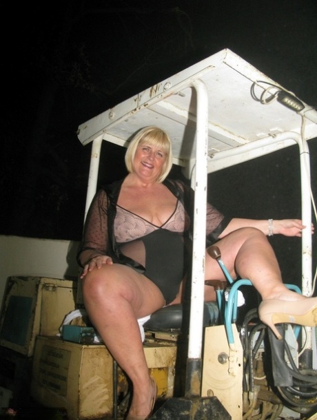 Older blonde BBW Chrissy Uk looses her boobs from lingerie during solo action