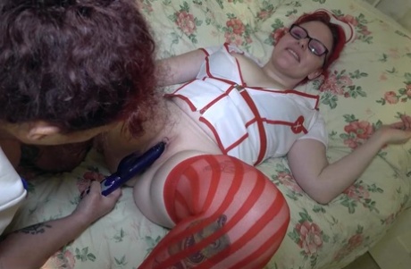 British nurse Mollie Foxxx has her pussy masturbated by a lesbian friend