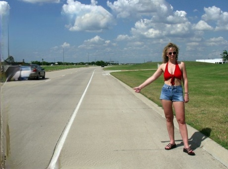 Older lady Ginger Klixen has sex in a field after being picked up hitchhiking