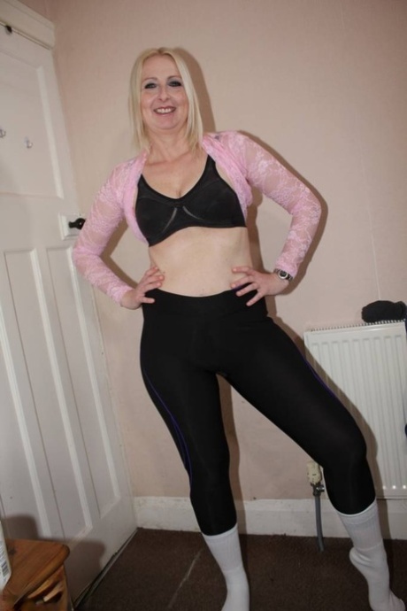 Blonde British woman Tracey Lain strips to white socks before a POV fuck