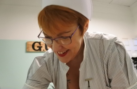 Older redheaded nurse Layla Bird has sex with a patient at work