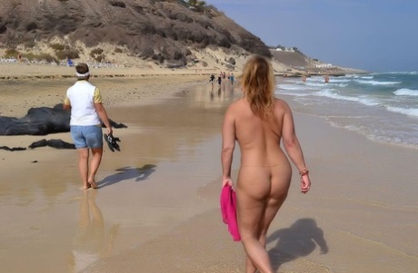 Thick middle-aged blonde Nude Chrissy goes nude while at a public beach