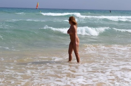 Thick middle-aged blonde Nude Chrissy goes nude while at a public beach