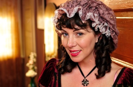 Hot mature brunette RayVeness shows sexy cleavage wearing medieval costume