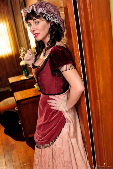 Hot mature brunette RayVeness shows sexy cleavage wearing medieval costume
