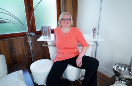 Mature housewife on the heavy side keeps her glasses on while stripping naked