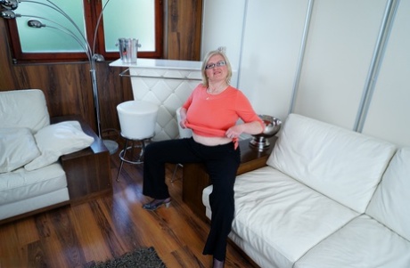Mature housewife on the heavy side keeps her glasses on while stripping naked