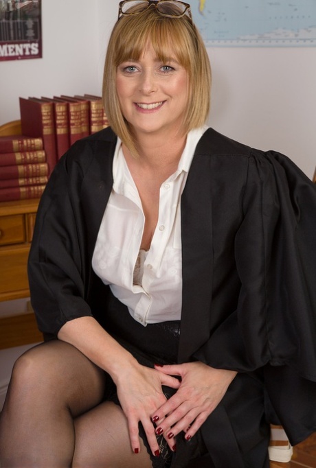 Fat female professor fingers her horny pussy after disrobing in her classroom