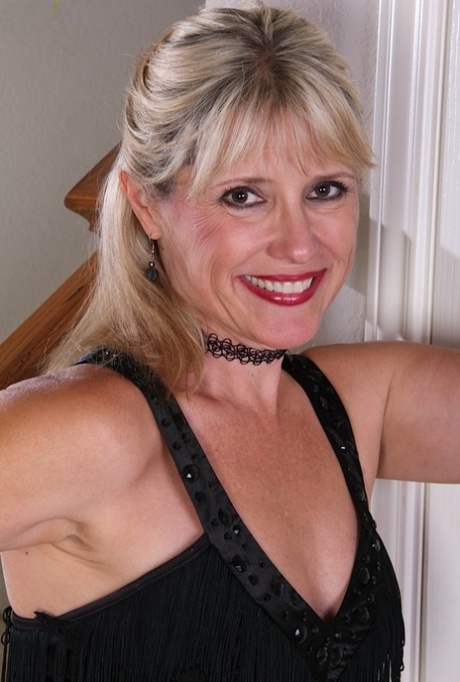 Classy mature lady Rebecca Hill exposes her clitoris with painted fingernails