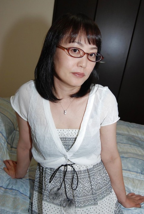 Shy asian lady in glasses strips down and has some pussy vibing fun