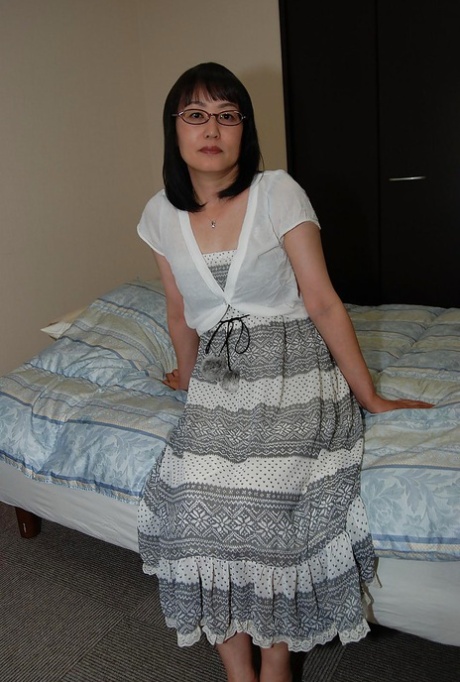 Shy asian lady in glasses strips down and has some pussy vibing fun