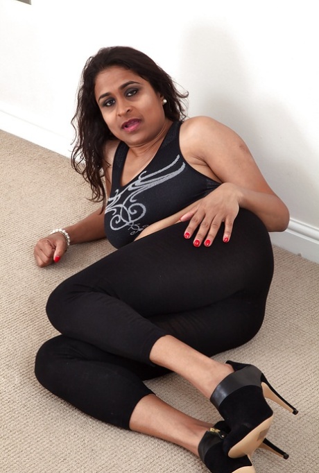 Dirty-minded mature lassie undressing and exposing her shaggy twat