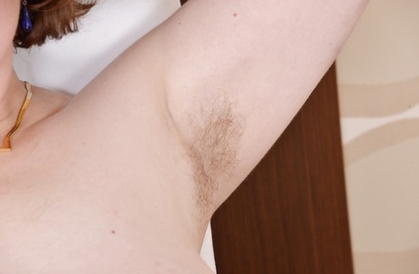 Fatty mature lassie with hairy armpits and shaggy cooter stripping down