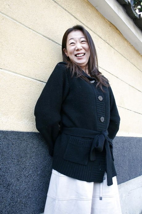 Outdoor posing scene featuring horny Asian mature Yoshiko Makihara