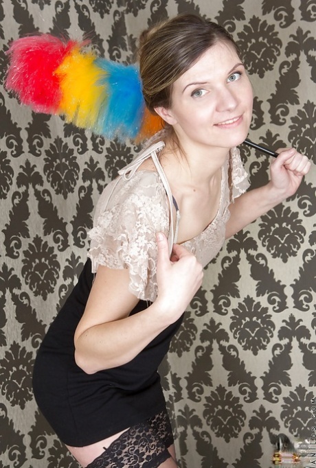 Sexy mature maid Agatha is doing some cleaning in her uniform