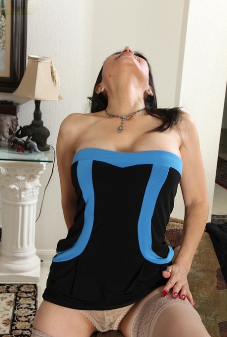 Mature brunette Marcy Darling shows off her big tits in close up