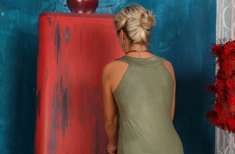 Mature lady Janet Darling drops sexy dress for the nude look