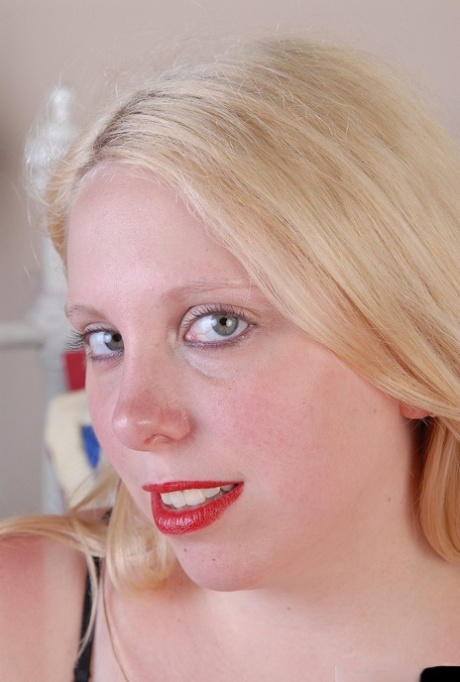 Chubby blonde girl Christal removes sexy lingerie and licks own nipples