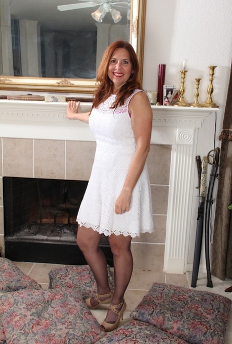 Chunky mature woman Bobby Jackson stripping off pantyhose in high heels