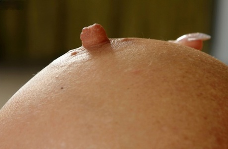 Aged blonde babe Casey Szilvia freeing big boobs and spreading pussy
