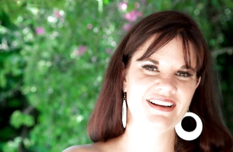 Aged pornstar wife Victoria Miller sheds bikini outside before masturbating