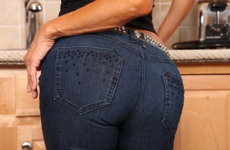Aged Latina Tara Holiday stripping nude in kitchen for masturbation session