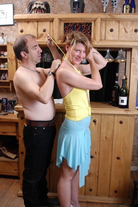 Mature chick Linda undress and fucked from behind in home bar