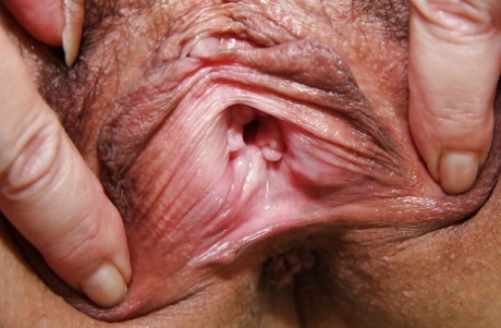 Kinky mature nurse stretching her twat with her fingers and toying it