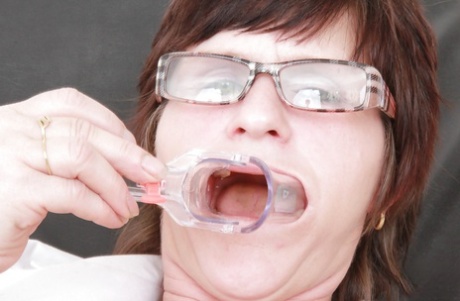 Filthy mature nurse in glasses stuffing her twat with toys and gyno tools