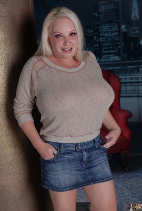 Blonde cougar Rachel Love exposes her tremendous breasts and flaunts them