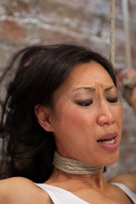 Hot Asian MILF Tia Ling gets tied up and punished with a vibrator