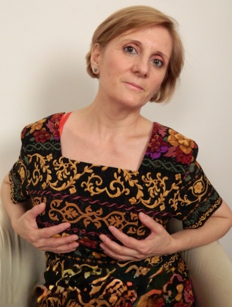 European Sage loses her dress & flaunts her huge tits while toying her twat