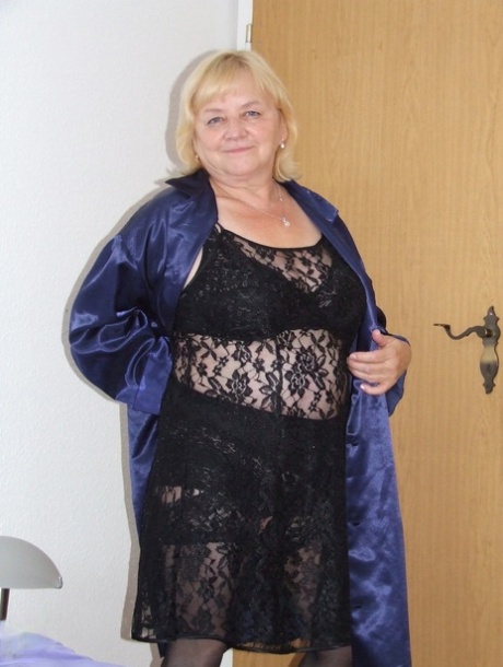 Amateur BBW Agnes strips to her stockings & shows her boobs & hairy pussy