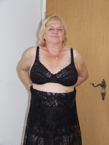 Amateur BBW Agnes strips to her stockings & shows her boobs & hairy pussy