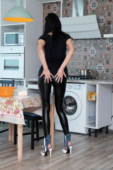 Skinny mature Nimfa Mannay plays with her hairy armpits and rubs her bush