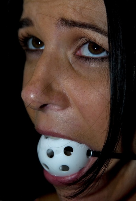 Black-haired mature India Summer gets gagged & toyed in a concrete room
